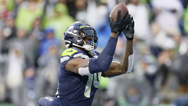 SEATTLE, WASHINGTON - JANUARY 02: DK Metcalf #14 of the Seattle Seahawks catches a pass for a touchdown against the Detroit Lions during the first half at Lumen Field on January 02, 2022 in Seattle, Washington.