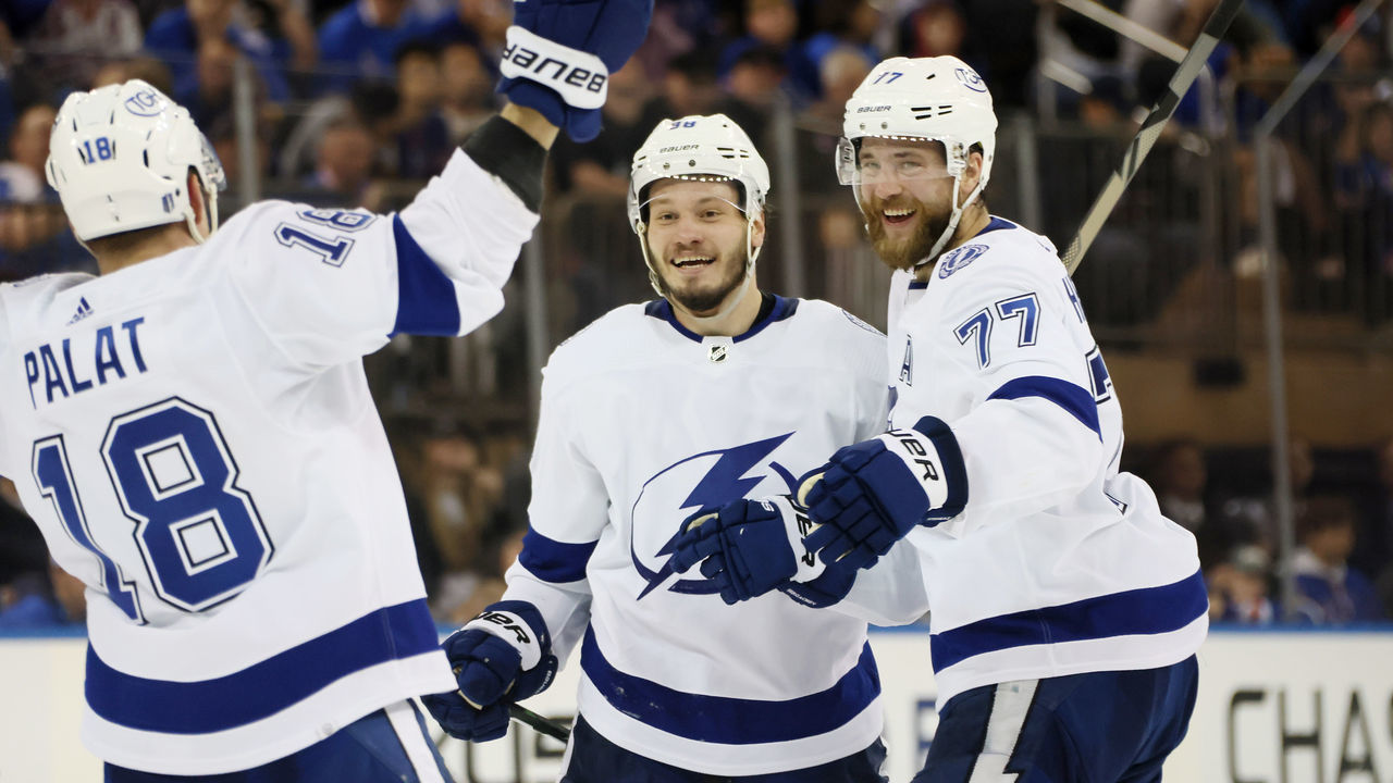 NEW YORK, NEW YORK - JUNE 09: Mikhail Sergachev #98 of the Tampa Bay Lightning celebrates with teammates after shooting the go-ahead goal against the New York Rangers during the third period in Game Five of the Eastern Conference Final of the 2022 Stanley Cup Playoffs at Madison Square Garden on June 09, 2022 in New York City. The goal was later credited to Ondrej Palat #18 of the Tampa Bay Lightning (not pictured).