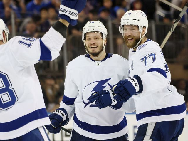 NEW YORK, NEW YORK - JUNE 09: Mikhail Sergachev #98 of the Tampa Bay Lightning celebrates with teammates after shooting the go-ahead goal against the New York Rangers during the third period in Game Five of the Eastern Conference Final of the 2022 Stanley Cup Playoffs at Madison Square Garden on June 09, 2022 in New York City. The goal was later credited to Ondrej Palat #18 of the Tampa Bay Lightning (not pictured).