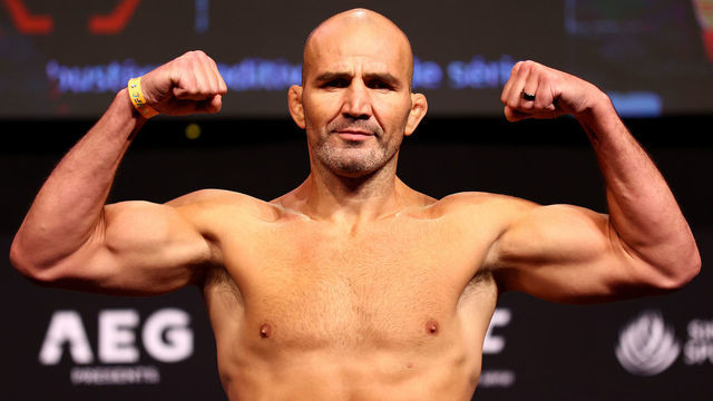 SINGAPORE, SINGAPORE - JUNE 10: UFC light heavyweight champion Glover Teixeira of Brazil poses on the scale ahead of his title defense bout against Jiri Prochazka of the Czech Republic during the UFC 275 Weigh-in at Singapore Indoor Stadium on June 10, 2022 in Singapore.