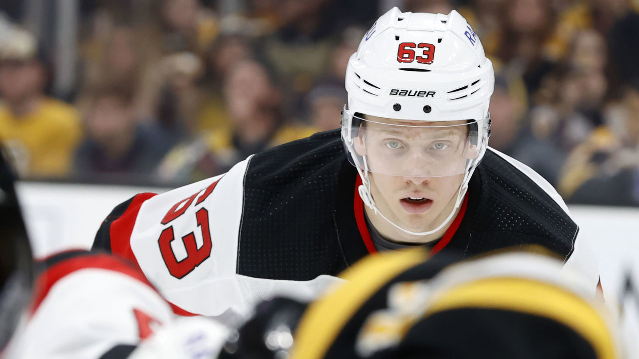 BOSTON, MA - MARCH 31: New Jersey Devils right wing Jesper Bratt (63) eyes the draw during a game between the Boston Bruins and the New Jersey Devils on March 31, 2022, at TD Garden in Boston, Massachusetts.
