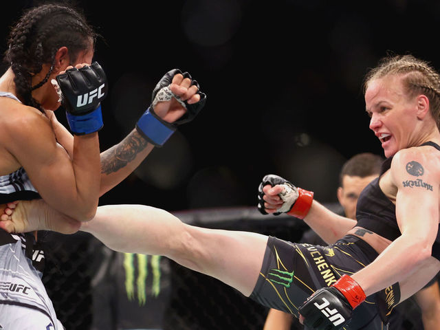 SINGAPORE, SINGAPORE - JUNE 12: Valentina Shevchenko of Kyrgyzstan exchanges strikes with Taila Santos of Brazil during their Women's Flyweight Fight at Singapore Indoor Stadium on June 12, 2022 in Singapore.
