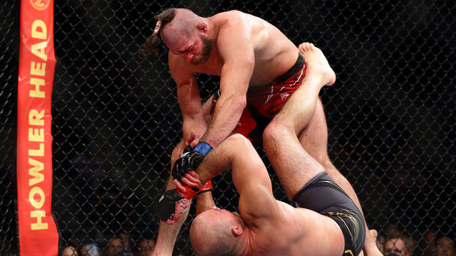 Jiri Prochazka of Czech Republic (top) battles Glover Teixeira of Brazil in the mens light heavyweight title bout during the UFC 275 event at Singapore Indoor Stadium on June 12, 2022 in Singapore.
