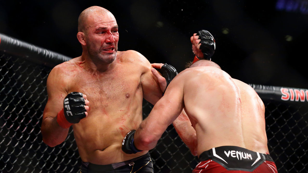 Jiri Prochazka of Czech Republic (R) battles Glover Teixeira of Brazil in the mens light heavyweight title bout during the UFC 275 event at Singapore Indoor Stadium on June 12, 2022 in Singapore.