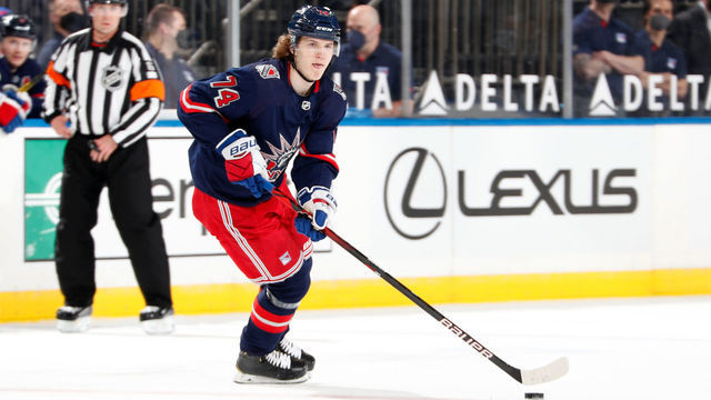 NEW YORK, NY - APRIL 15: Vitali Kravtsov #74 of the New York Rangers skates with the puck against the New Jersey Devils at Madison Square Garden on April 15, 2021 in New York City.