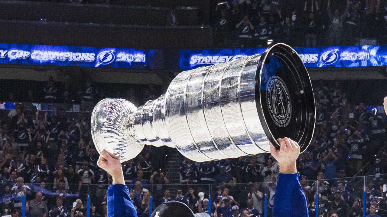 TAMPA, FL - JULY 7: Steven Stamkos #91 and Victor Hedman #77 of the Tampa Bay Lightning hoists the Stanley Cup overhead after the Tampa Bay Lightning defeated the Montreal Canadiens in Game Five to win the best of seven game series 4-1 during the Stanley Cup Final of the 2021 Stanley Cup Playoffs at Amalie Arena on July 7, 2021 in Tampa, Florida.