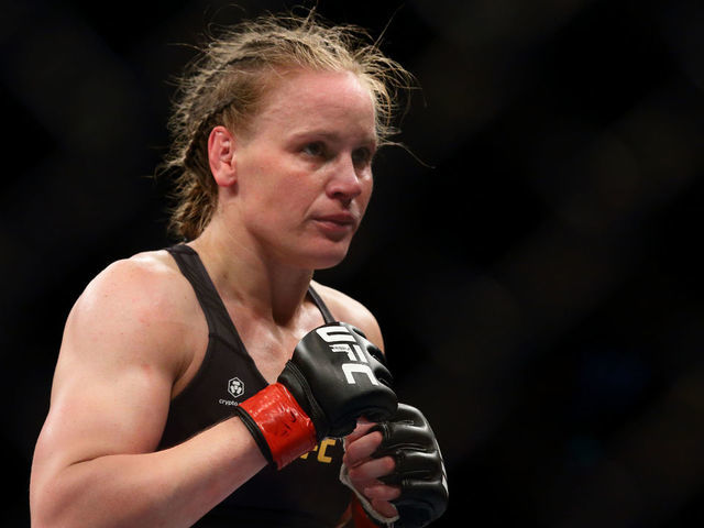 Valentina Shevchenko of Kyrgyzstan in action against Taila Santos of Brazil in the womens strawweight title bout during the UFC 275 event at Singapore Indoor Stadium on June 12, 2022 in Singapore.