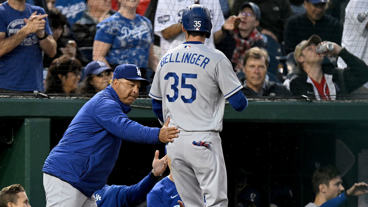 WASHINGTON, DC - MAY 23: Cody Bellinger #35 of the Los Angeles Dodgers celebrates with manager Dave Roberts #30 after scoring in the fourth inning against the Washington Nationals at Nationals Park on May 23, 2022 in Washington, DC.