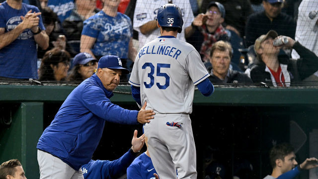WASHINGTON, DC - MAY 23: Cody Bellinger #35 of the Los Angeles Dodgers celebrates with manager Dave Roberts #30 after scoring in the fourth inning against the Washington Nationals at Nationals Park on May 23, 2022 in Washington, DC.