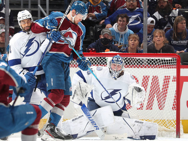 DENVER, COLORADO - FEBRUARY 10: Goaltender Andrei Vasilevskiy #88 of the Tampa Bay Lightning looks to make a save against the Colorado Avalanche next to teammate Pierre-Edouard Bellemare #41 and Valeri Nichushkin #13 at Ball Arena on February 10, 2022 in Denver, Colorado.