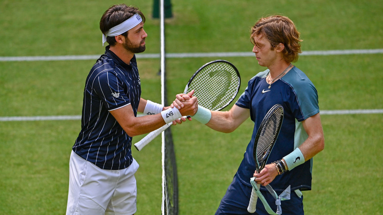 HALLE, GERMANY - JUNE 13: Andrey Rublev (R) of Russia congratulates Nikoloz Basilashvili of Georgia during day three of the 29th Terra Wortmann Open at OWL-Arena on June 13, 2022 in Halle, Germany.