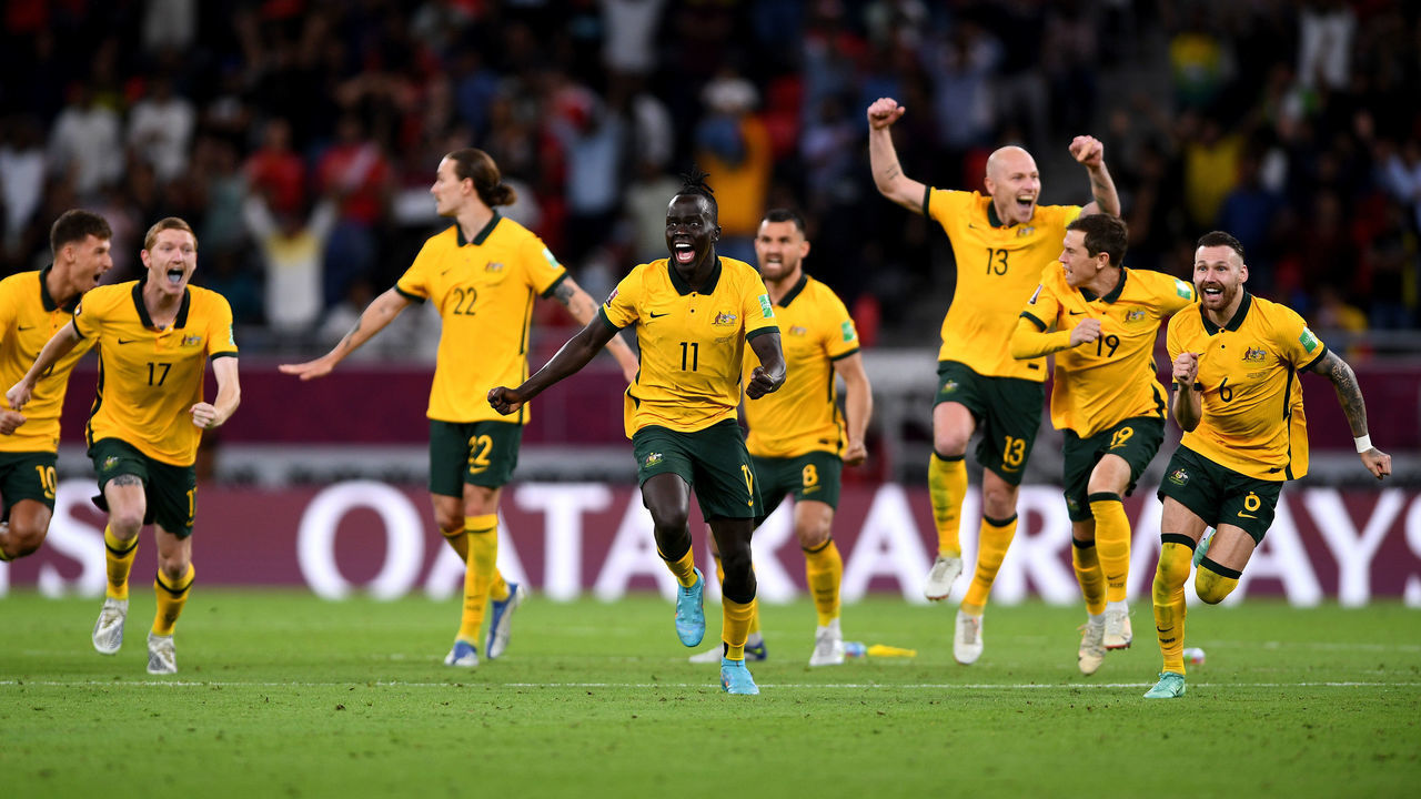 DOHA, QATAR - JUNE 13: Australia celebrate after winning the game in penalty shootouts in the 2022 FIFA World Cup Playoff match between Australia Socceroos and Peru at Ahmad Bin Ali Stadium on June 13, 2022 in Doha, Qatar.