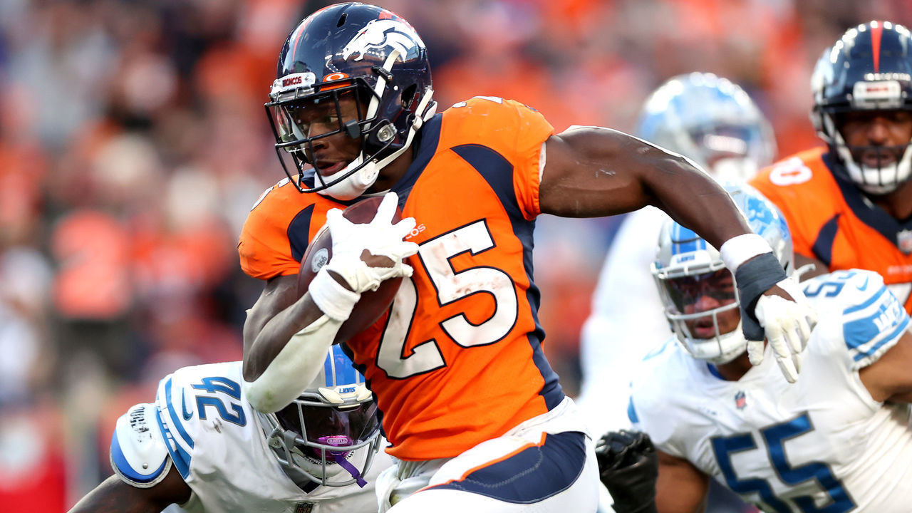 DENVER, COLORADO - DECEMBER 12: Melvin Gordon III #25 of the Denver Broncos runs with the ball on his way to a rushing touchdown against the Detroit Lions during the third quarter at Empower Field At Mile High on December 12, 2021 in Denver, Colorado.