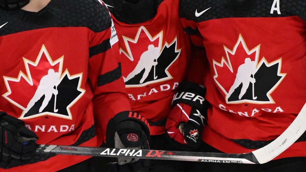 Canada's forward Cole Sillinger (L) celebrates with Canada's forward Matt Barzal (C) and Canada's forward Josh Anderson scoring during the IIHF Ice Hockey World Championships half final match between Canada and Czech Republic in Tampere, Finland, on May 28, 2022.