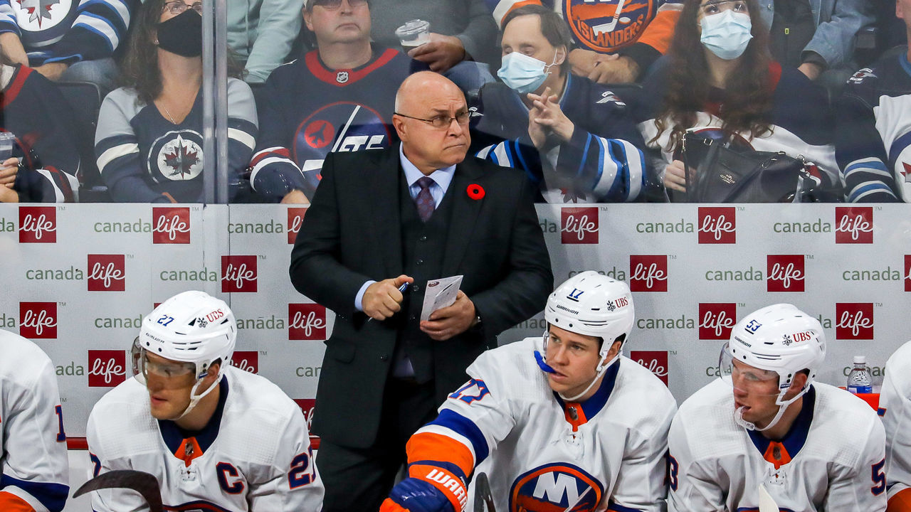 WINNIPEG, MB - NOVEMBER 6: Head Coach Barry Trotz of the New York Islanders keeps an eye on the play from the bench during third period action against the Winnipeg Jets at the Canada Life Centre on November 6, 2021 in Winnipeg, Manitoba, Canada.