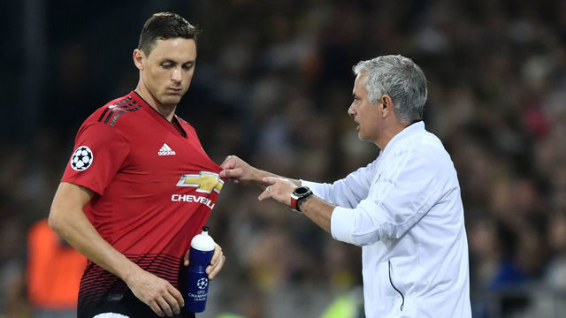 Manchester United's Portuguese manager Jose Mourinho (R) gestures as he speaks with Manchester United's Serbian midfielder Nemanja Matic during the UEFA Champions League group H football match between Young Boys and Manchester United at The Stade de Suisse in Bern on September 19, 2018.