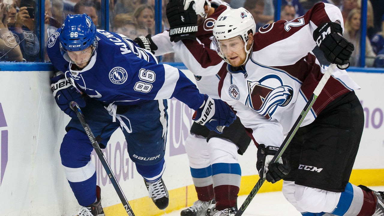 TAMPA, FL - OCTOBER 29: Nikita Kucherov #86 of the Tampa Bay Lightning races for the puck against Nathan MacKinnon #29 of the Colorado Avalanche during third period at the Amalie Arena on October 29, 2015 in Tampa, Florida.