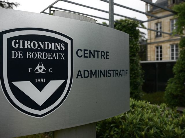This general view taken on May 19, 2022, shows a sign with a logo in front of the chateau of FC Girondins de Bordeaux at the club's training ground in Le Haillan, near Bordeaux, south-western France.