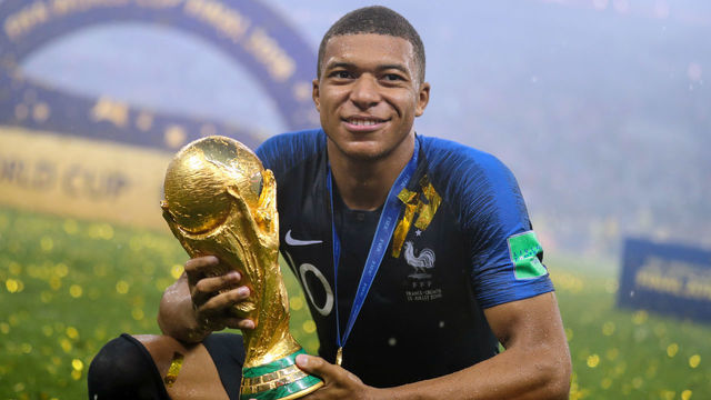 MOSCOW, RUSSIA - JULY 15: Kyliane Mbappe of France celebrates with the World Cup Trophy following his sides victory in the 2018 FIFA World Cup between France and Croatia at Luzhniki Stadium on July 15, 2018 in Moscow, Russia.