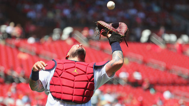 ST LOUIS, MO - JUNE 14: Yadier Molina #4 of the St. Louis Cardinals catches a pop-up against the Pittsburgh Pirates in the sixth inning during game one of a doubleheader at Busch Stadium on June 14, 2022 in St Louis, Missouri. The catch was the 14,865th putout of Molina's career, passing Hall of Famer Ivan Rodriguez for the MLB record.