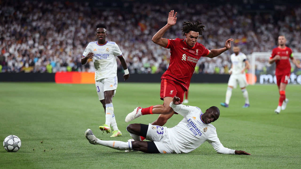 PARIS, FRANCE - MAY 28: Trent Alexander-Arnold of Liverpool is challenged by Ferland Mendy of Real Madrid during the UEFA Champions League final match between Liverpool FC and Real Madrid at Stade de France on May 28, 2022 in Paris, France.