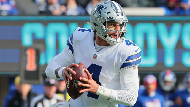EAST RUTHERFORD, NEW JERSEY - DECEMBER 19: Dak Prescott #4 of the Dallas Cowboys scrambles with the ball during the first quarter against the New York Giants at MetLife Stadium on December 19, 2021 in East Rutherford, New Jersey.