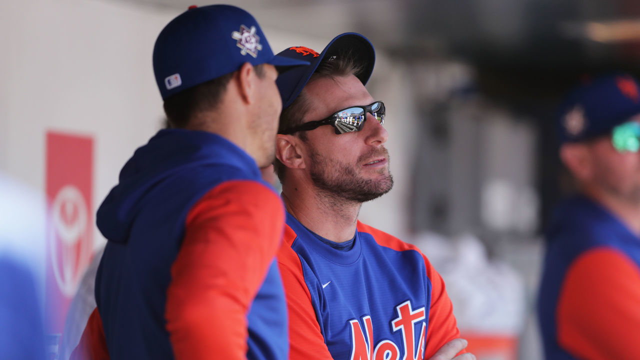 NEW YORK, NY - APRIL 15: Jacob deGrom #48 of the New York Mets talks with Max Scherzer #21 in the dugout during the game between the Arizona Diamondbacks and the New York Mets at Citi Field on Friday, April 15, 2022 in New York, New York. All players wear the number 42 on their jerseys in honor of Jackie Robinson.