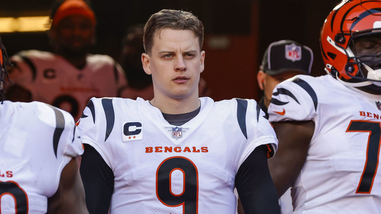 KANSAS CITY, MO - JANUARY 30: Joe Burrow #9 of the Cincinnati Bengals walks out of the players tunnel at halftime with teammates Zach Kerr #69 and D'Ante Smith #70 during the AFC Championship Game against the Kansas City Chiefs at Arrowhead Stadium on January 30, 2022 in Kansas City, Missouri, United States.