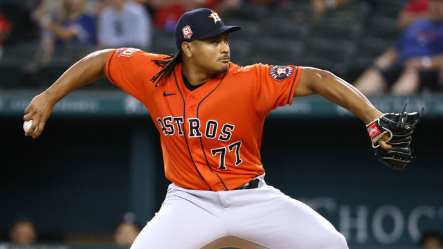 ARLINGTON, TX - JUNE 15: Luis Garcia #77 of the Houston Astros pitches against the Texas Rangers during the first inning at Globe Life Field on June 15, 2022 in Arlington, Texas.