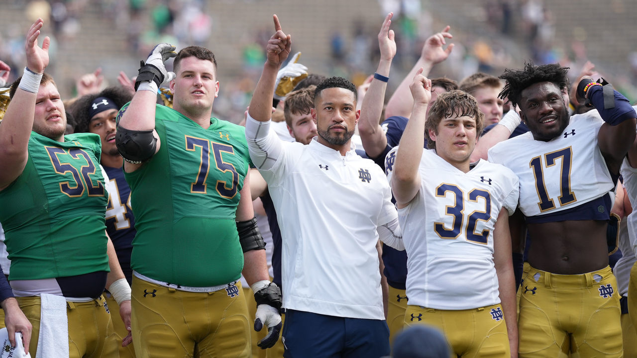 SOUTH BEND, IN - APRIL 23: Notre Dame Fighting Irish head coach Marcus Freeman celebrates with players after the Notre Dame Blue-Gold Spring Football Game on April 23, 2022 at Notre Dame Stadium in South Bend, IN.
