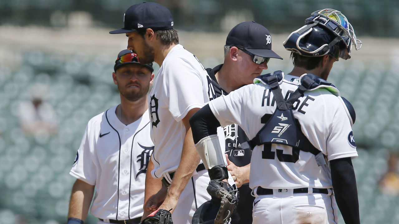 DETROIT, MI - JUNE 15: Alex Faedo #49 of the Detroit Tigers is pulled by manager A.J. Hinch #14 with catcher Eric Haase #13 and third baseman Kody Clemens #21 on the mound during the fourth inning of a game against the Chicago White Sox at Comerica Park on June 15, 2022, in Detroit, Michigan.
