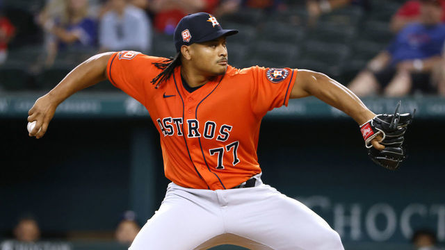 ARLINGTON, TX - JUNE 15: Luis Garcia #77 of the Houston Astros pitches against the Texas Rangers during the first inning at Globe Life Field on June 15, 2022 in Arlington, Texas.