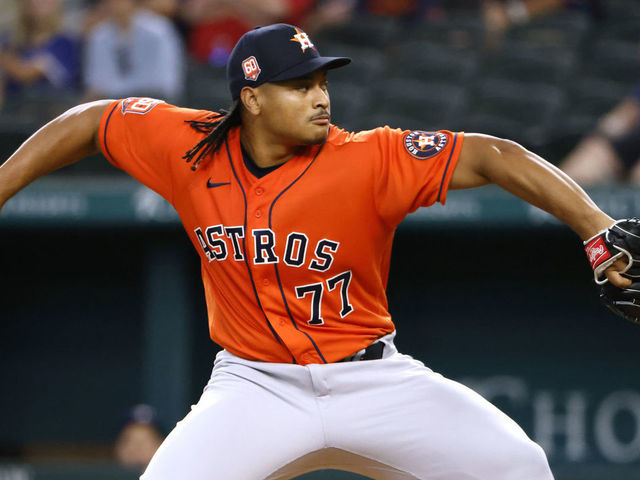 ARLINGTON, TX - JUNE 15: Luis Garcia #77 of the Houston Astros pitches against the Texas Rangers during the first inning at Globe Life Field on June 15, 2022 in Arlington, Texas.