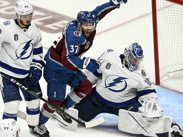 DENVER, CO - JUNE 15: J.T. Compher (37) of the Colorado Avalanche celebrates much to the chagrin of Mikhail Sergachev (98) and Andrei Vasilevskiy (88) of the Tampa Bay Lightning after Andre Burakovsky (95) scored a game winner during overtime of Colorado"u2019s 4-3 win in game one of the Stanley Cup Finals at Ball Arena in Denver on Wednesday, June 15, 2022.