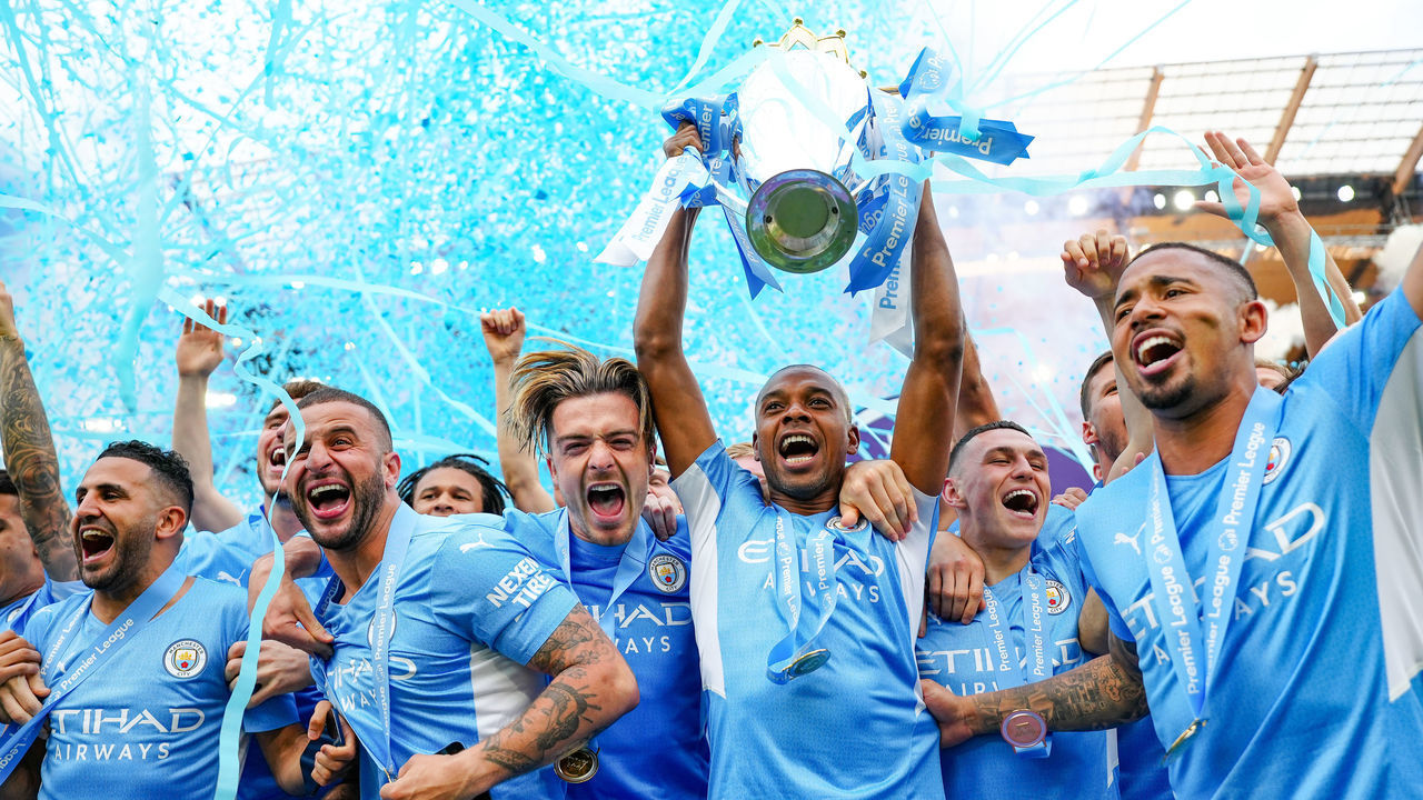 MANCHESTER, ENGLAND - MAY 22: Manchester City's Fernandinho lifts the Premier League Trophy after their side finished the season as Premier League champions after the Premier League match between Manchester City and Aston Villa at Etihad Stadium on May 22, 2022 in Manchester, England.