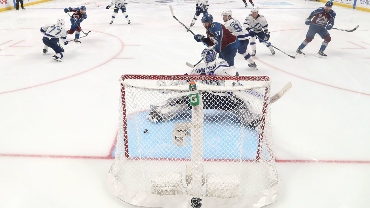 DENVER, COLORADO - JUNE 15: Andre Burakovsky #95 of the Colorado Avalanche scores a goal against Andrei Vasilevskiy #88 of the Tampa Bay Lightning during overtime to win Game One of the 2022 Stanley Cup Final 4-3 at Ball Arena on June 15, 2022 in Denver, Colorado.