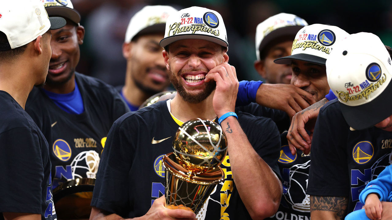 BOSTON, MASSACHUSETTS - JUNE 16: Stephen Curry #30 of the Golden State Warriors celebrates with the Bill Russell NBA Finals Most Valuable Player Award after defeating the Boston Celtics 103-90 in Game Six of the 2022 NBA Finals at TD Garden on June 16, 2022 in Boston, Massachusetts. NOTE TO USER: User expressly acknowledges and agrees that, by downloading and/or using this photograph, User is consenting to the terms and conditions of the Getty Images License Agreement.