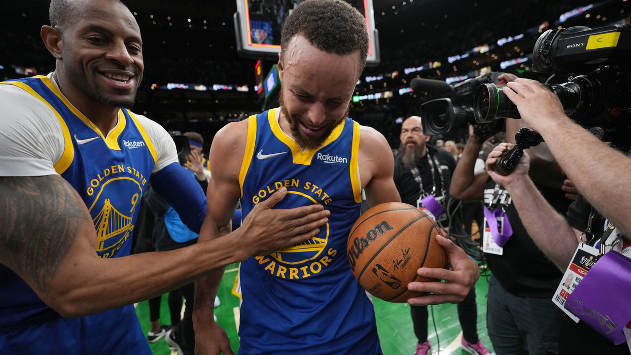 BOSTON, MA - JUNE 16: Andre Iguodala #9 of the Golden State Warriors embraces Stephen Curry #30 of the Golden State Warriors after Game Six of the 2022 NBA Finals on June 16, 2022 at TD Garden in Boston, Massachusetts. NOTE TO USER: User expressly acknowledges and agrees that, by downloading and or using this photograph, user is consenting to the terms and conditions of Getty Images License Agreement. Mandatory Copyright Notice: Copyright 2022 NBAE