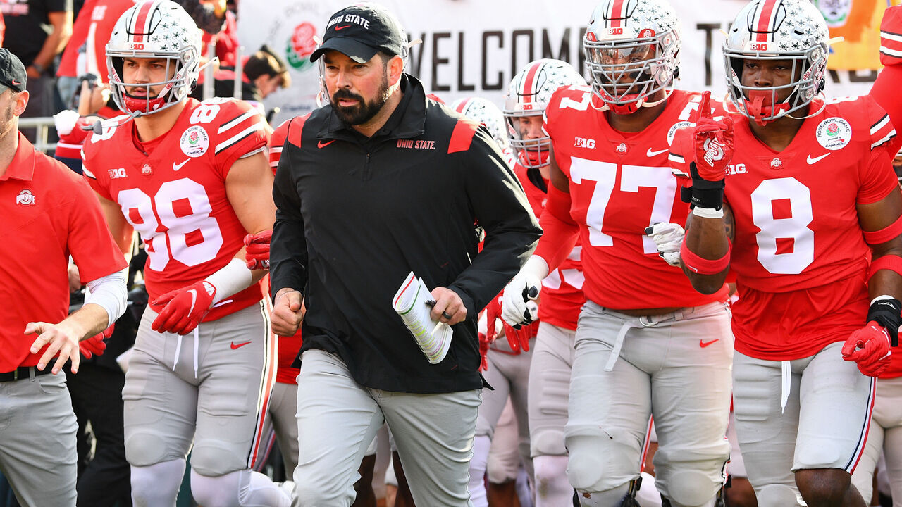 PASADENA, CA - JANUARY 01: Ohio State Buckeyes head coach Ryan Day leads his team out to the field before the Rose Bowl game between the Ohio State Buckeyes and the Utah Utes on January 1, 2022 at the Rose Bowl in Pasadena, CA.