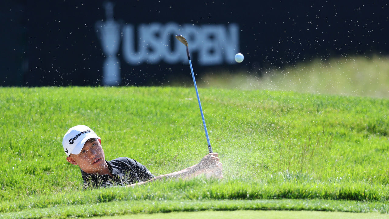 BROOKLINE, MASSACHUSETTS - JUNE 14: Collin Morikawa of the United States plays a shot from a bunker on the second hole during a practice round prior to the US Open at The Country Club on June 14, 2022 in Brookline, Massachusetts.