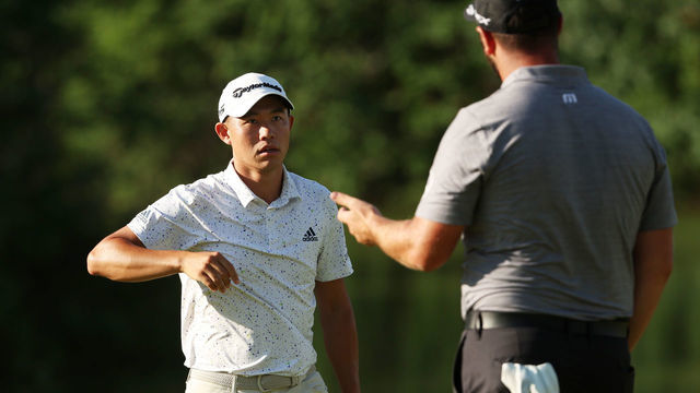 BROOKLINE, MASSACHUSETTS - JUNE 17: (L-R) Collin Morikawa of the United States and Jon Rahm of Spain complete their round on the ninth green during the second round of the 122nd U.S. Open Championship at The Country Club on June 17, 2022 in Brookline, Massachusetts.