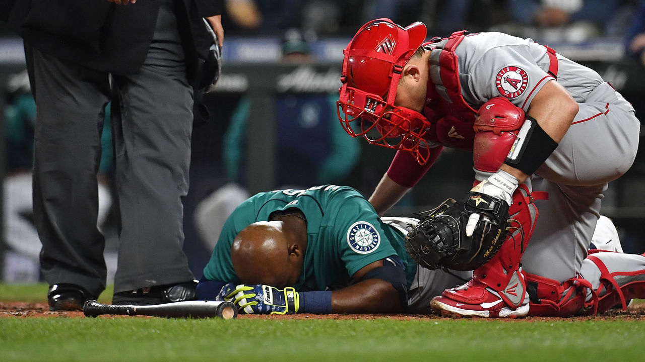 SEATTLE, WASHINGTON - JUNE 17: Justin Upton #8 of the Seattle Mariners is down after being hit by a pitch during the fifth inning against the Los Angeles Angels at T-Mobile Park on June 17, 2022 in Seattle, Washington.