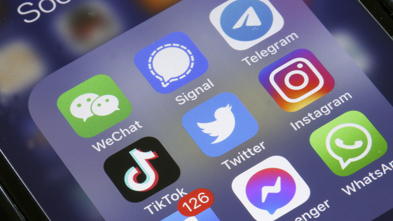 PARIS, FRANCE - APRIL 26: In this photo illustration, the logos of social media applications, Instagram, WhatsApp, Messenger, WeChat, Signal, Telegram, TikTok, Twitter and Facebook are displayed on the screen of an iPhone on April 26, 2022 in Paris, France. The U.S. multi-billionaire Elon Musk bought the social network Twitter on Monday April 25 for the sum of 44 billion dollars after two weeks of arm wrestling with the company's board of directors. (Photo illustration by Chesnot/Getty Images)
