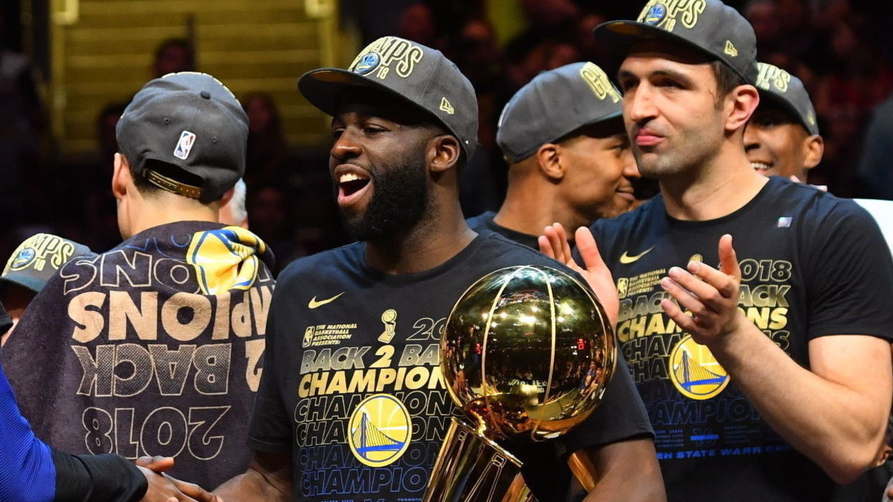 CLEVELAND, OH - JUNE 8: Kevin Durant #35 and Draymond Green #23 of the Golden State Warriors exchange handshakes after received the Larry O'Brien Championship trophy by defeating the Cleveland Cavaliers in Game Four of the 2018 NBA Finals on June 8, 2018 at Quicken Loans Arena in Cleveland, Ohio. NOTE TO USER: User expressly acknowledges and agrees that, by downloading and/or using this Photograph, user is consenting to the terms and conditions of the Getty Images License Agreement. Mandatory Copyright Notice: Copyright 2018 NBAE