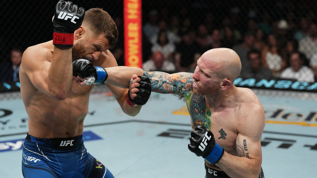 AUSTIN, TEXAS - JUNE 18: (R-L) Josh Emmett punches Calvin Kattar in a featherweight fight during the UFC Fight Night event at Moody Center on June 18, 2022 in Austin, Texas.