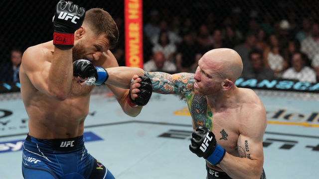AUSTIN, TEXAS - JUNE 18: (R-L) Josh Emmett punches Calvin Kattar in a featherweight fight during the UFC Fight Night event at Moody Center on June 18, 2022 in Austin, Texas.