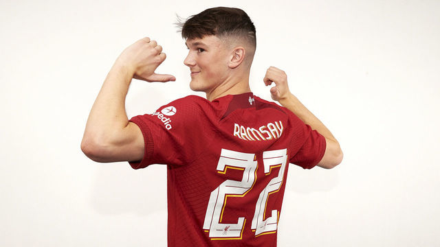 KIRKBY, ENGLAND - JUNE 19: New Liverpool signing Calvin Ramsey signs for the club at AXA Training Centre on June 19, 2022 in Kirkby, England.