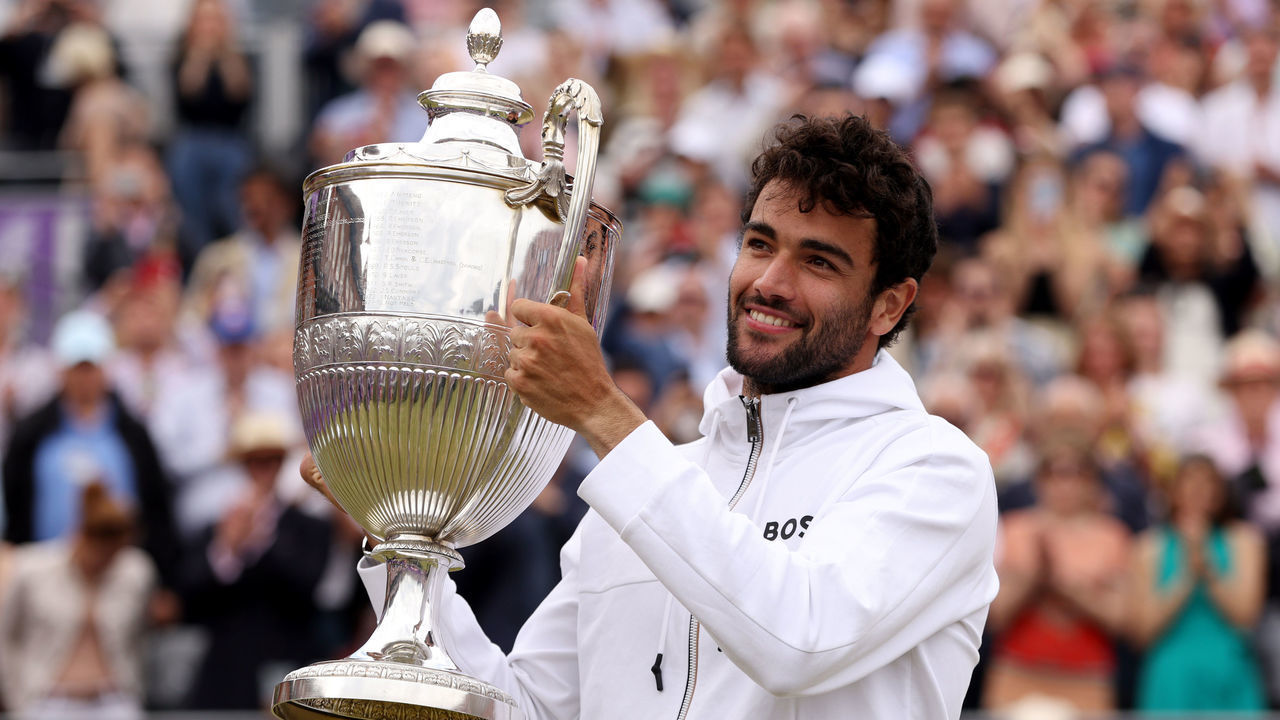 LONDON, ENGLAND - JUNE 19: Matteo Berrettini of Italy celebrates with the trophy after winning against Filip Krajinovic of Serbia during the Men's Singles Final match on day seven of the cinch Championships at The Queen's Club on June 19, 2022 in London, England.