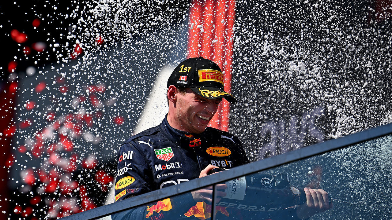 MONTREAL, QUEBEC - JUNE 19: Race winner Max Verstappen of the Netherlands and Oracle Red Bull Racing celebrates on the podium during the F1 Grand Prix of Canada at Circuit Gilles Villeneuve on June 19, 2022 in Montreal, Quebec.