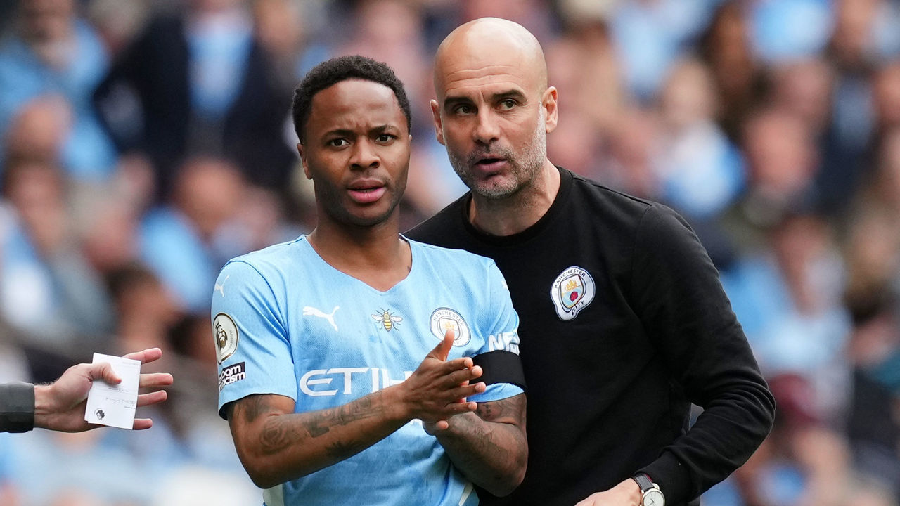 MANCHESTER, ENGLAND - MAY 22: Pep Guardiola gives instructions to Raheem Sterling of Manchester City before they are substituted on during the Premier League match between Manchester City and Aston Villa at Etihad Stadium on May 22, 2022 in Manchester, England.